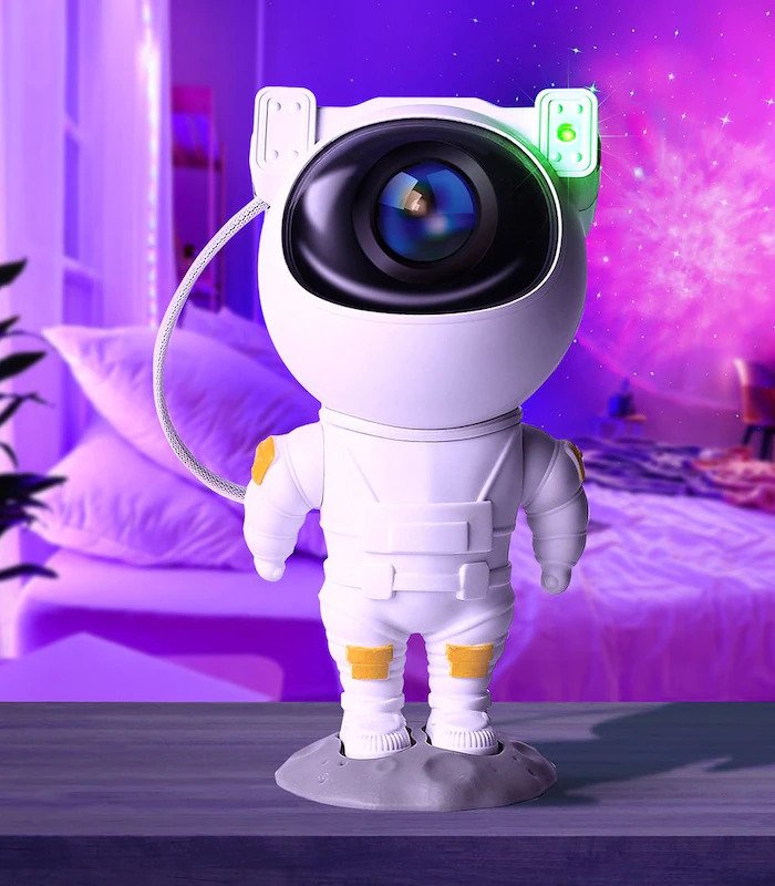 Cute-Galaxy-Star-Astronaut-Projector-Light-Cool-Nightlight-for-Kids-Led-Pluto-Space-Sky-Light-Light-Soothing-Cosmo-Suitable-for-Kids-Room-Gift-Room-Decor-buy-online-Beirut-Lebanon Astronaut galaxy projector lighting stars on ceiling | جهاز رائد فضاء يعرض النجوم على السقف