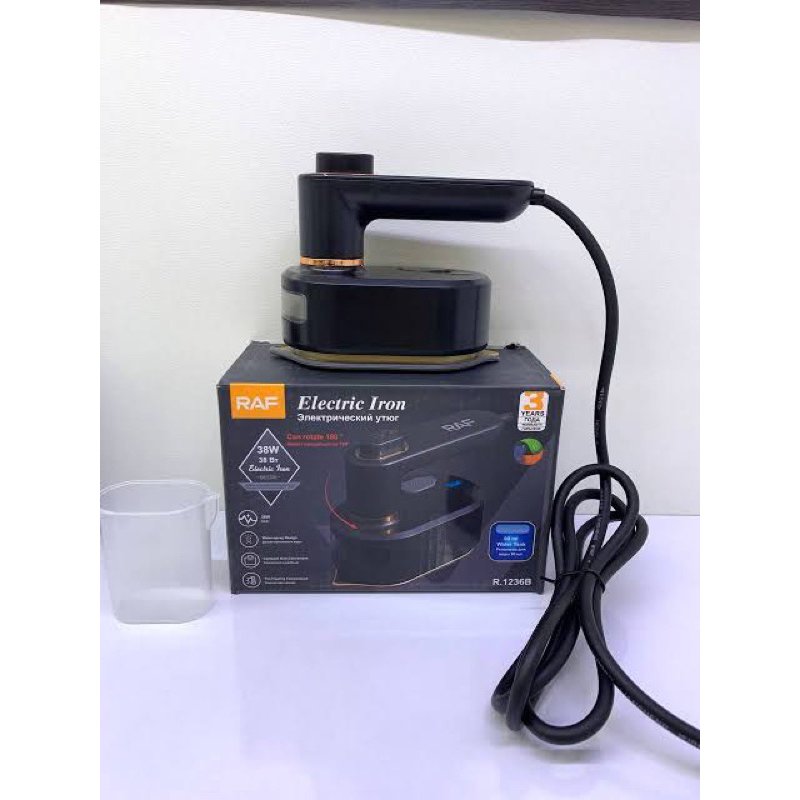 raf+mini+electric+iron+low+power+half+amp+compact+spray+buy+online+Beirut+Lebanon+مكواية+صغيرة+لا+تصرف+كهرباء مكواة راف الكهربائية الصغيرة موديل R.1236B بقوة ٣٨ واط مع مقبض دوار ولون أسود وذهبي.
