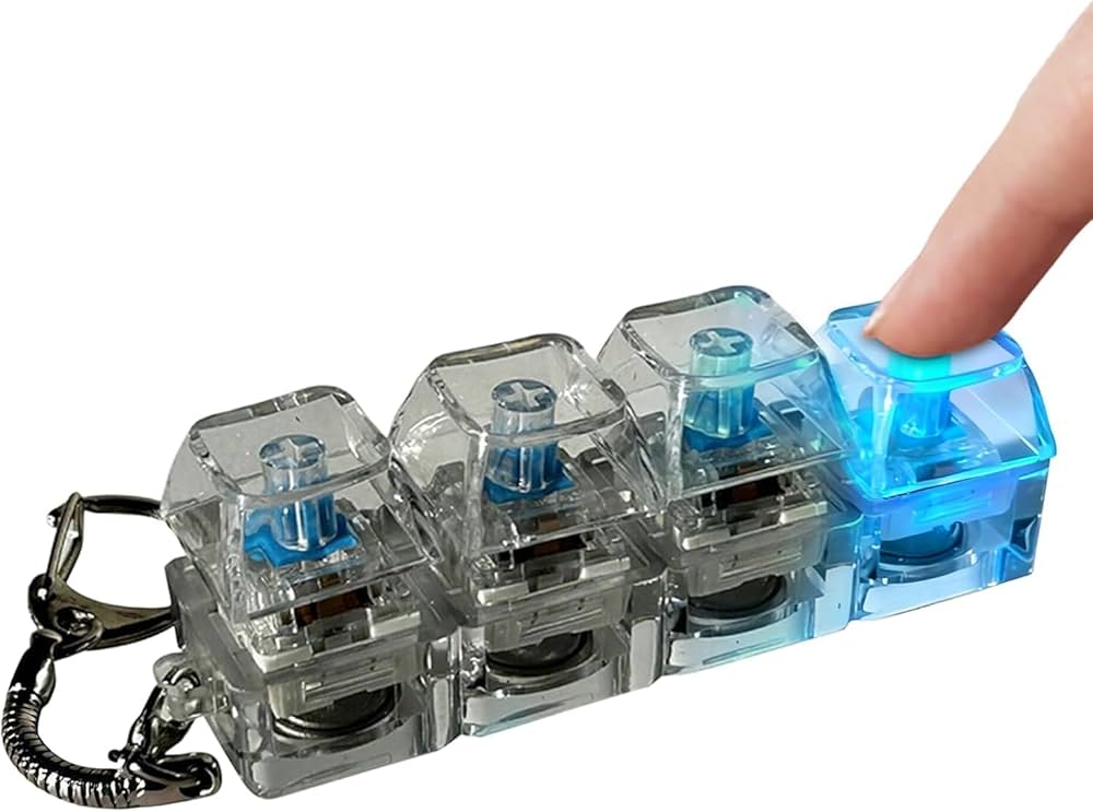 Fidget Keyboard Sensory Toy – Mini Mechanical Click Keychain buy online Beirut Lebanon لعبة أزرار كيبورد حسية Mini mechanical keyboard fidget sensory toy keychain with transparent blue click switches for stress relief and focus – portable keyboard clicker toy in Lebanon