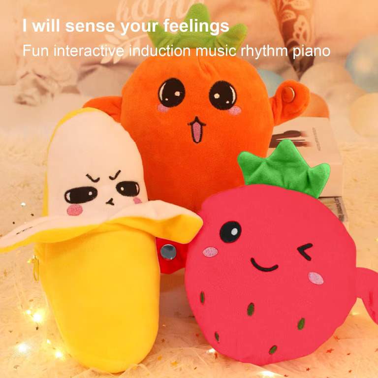 Fruit body sensing music piano plush Banana strawbery carrot fun toy for kids buy online Beirut Lebanon hand eye coordination A trio of cute, plush fruit and vegetable toys—a banana, a carrot, and a strawberry music piano interactive body sensing—each featuring expressive faces and soft textures, presented with promotional text that reads "I will sense your feelings" and "Fun interactive induction music rhythm piano," highlighting them as engaging, sensory-based toys for children.