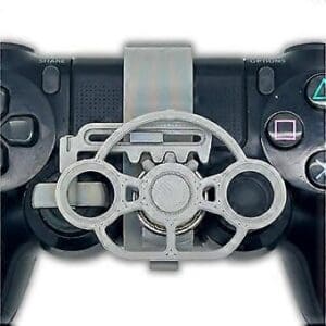 lose-up view of gamer hands holding a black PlayStation 4 controller with a yellow gear-based mini steering wheel attachment installed over the thumbstick for racing games.