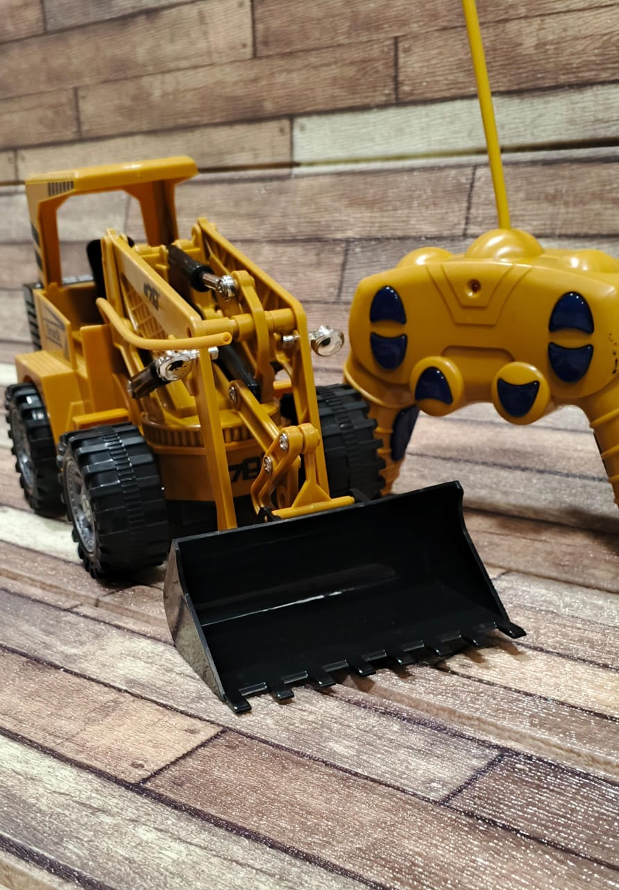 RC Bulldozer construction loader truck remote control toy for kids buy online Beirut Lebanon Yellow RC bulldozer construction loader toy with black scoop bucket and wireless remote control unit.
