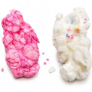 Pink and white Crackle Fluff crispy marshmallow squishy toys showing cracked shells and crushed pieces on a white background, available in Lebanon.