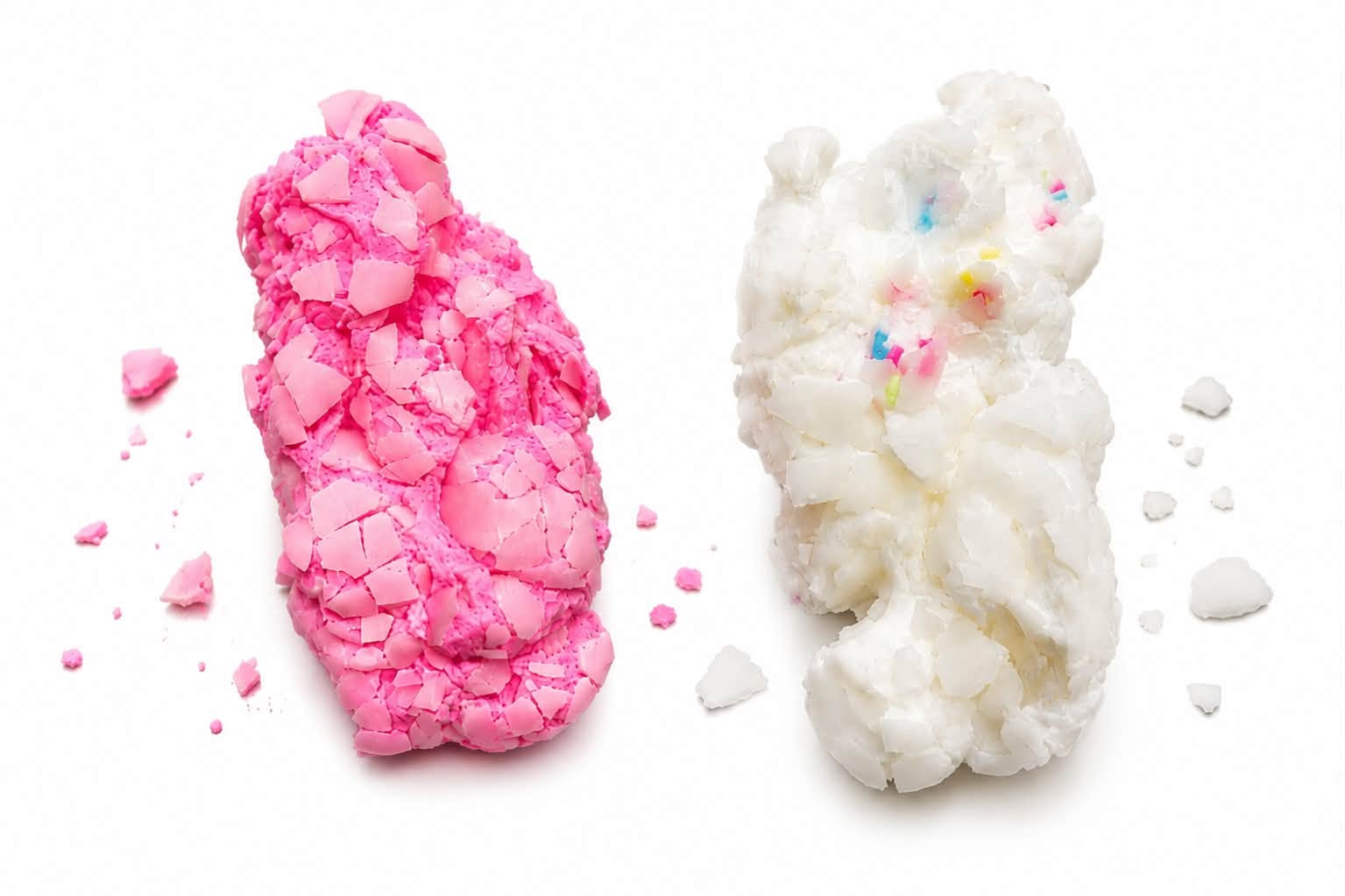 cracking squishy candy toy crunch sound fun buy online Beirut Lebanon Pink and white Crackle Fluff crispy marshmallow squishy toys showing cracked shells and crushed pieces on a white background, available in Lebanon.